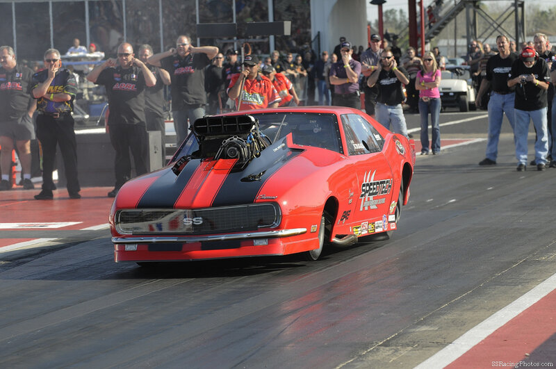 Red Drag Racing Car — Energetic, Afternoon, Photograph, Crowd, Race Track