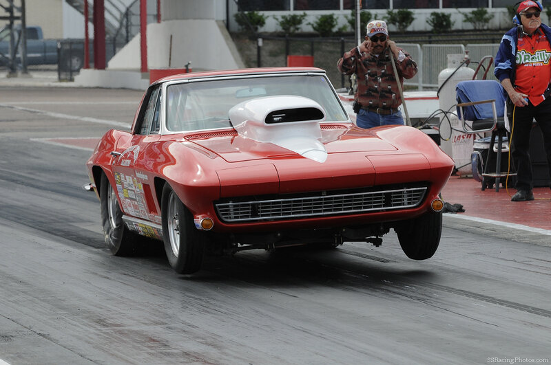 Red drag racing car on track