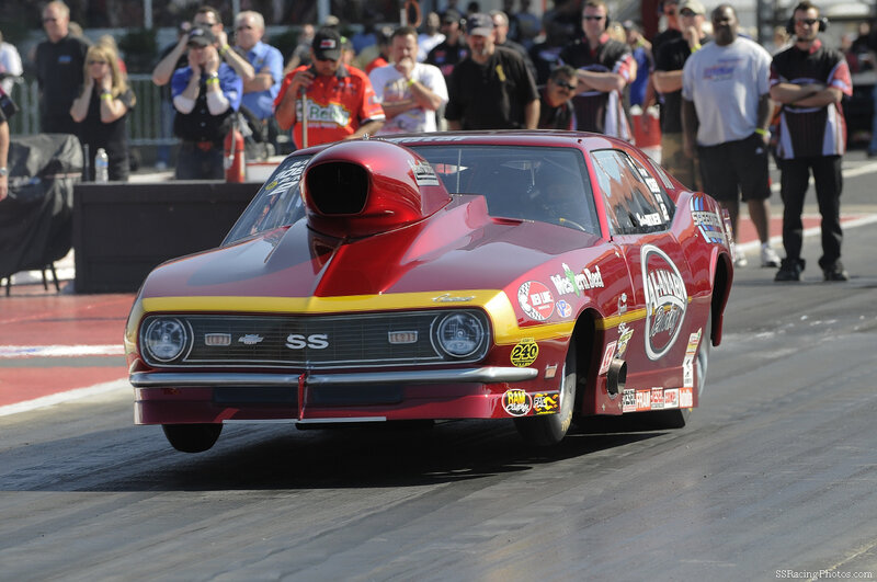 Red drag racing car on track