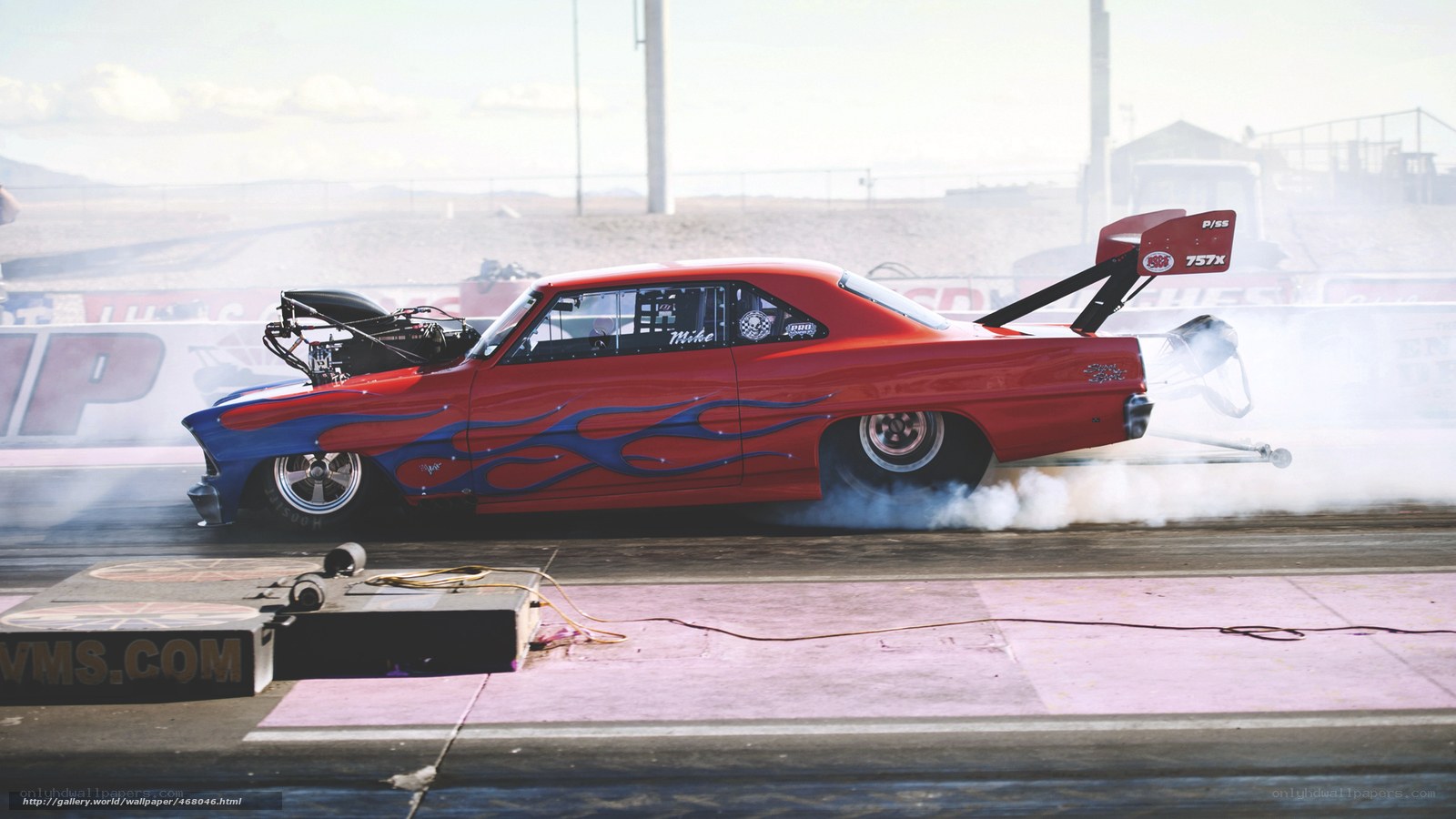 Red drag racing car on track
