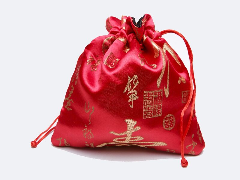 Red drawstring pouch with gold characters