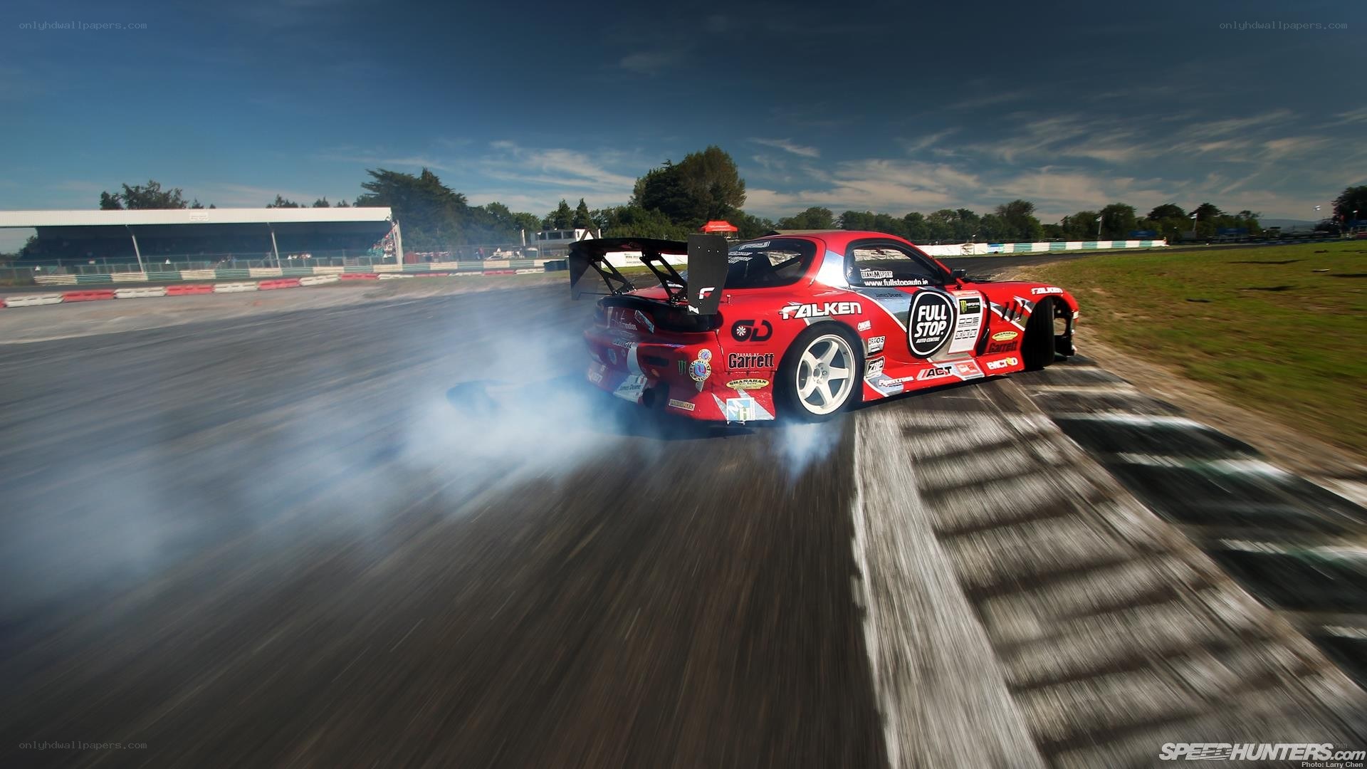 Red drift car on racetrack