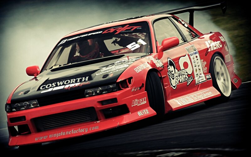 red drift race car in action