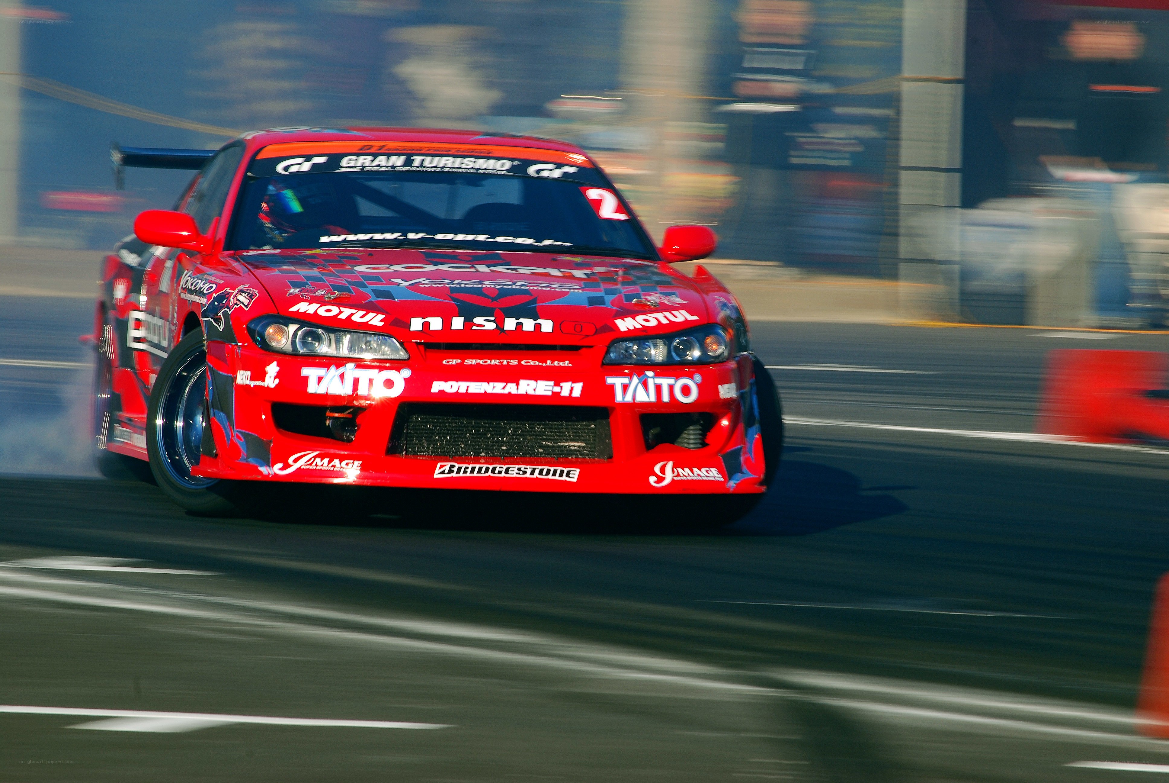 Red drift race car in action
