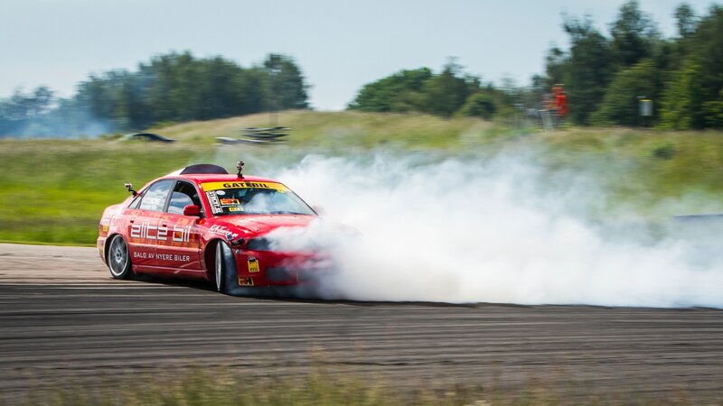 Red Drifting Car — Dynamic, Afternoon