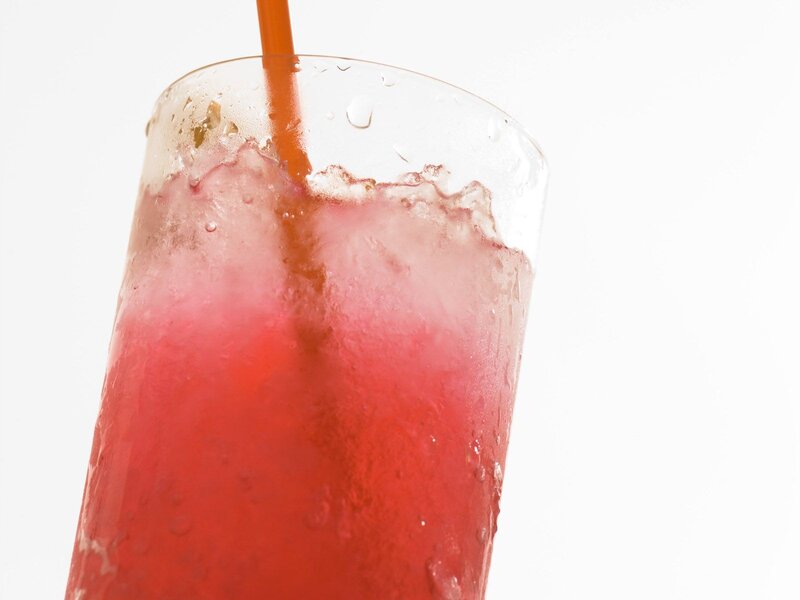 red drink with straw
