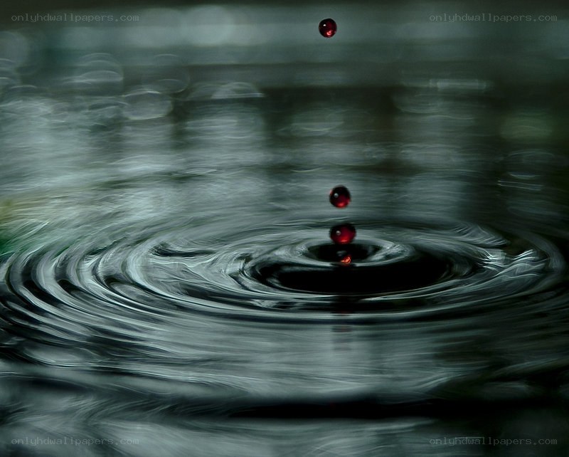 red droplets falling into water