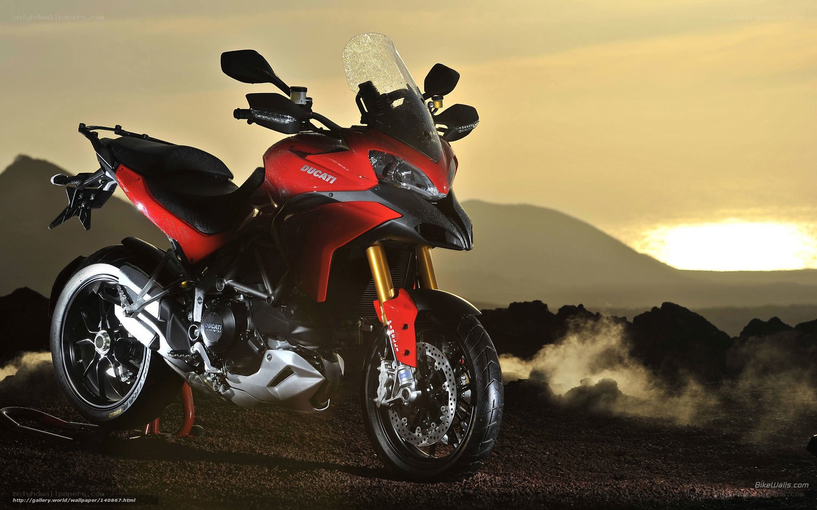 Red Ducati motorcycle at sunset
