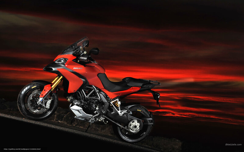 Red Ducati motorcycle at sunset
