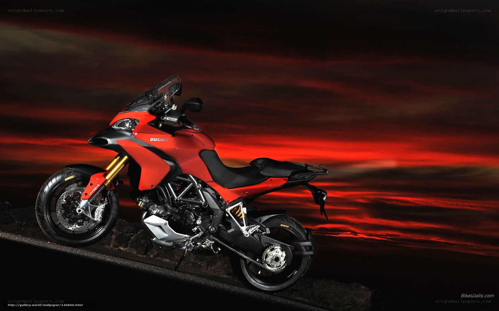 Red Ducati motorcycle at sunset