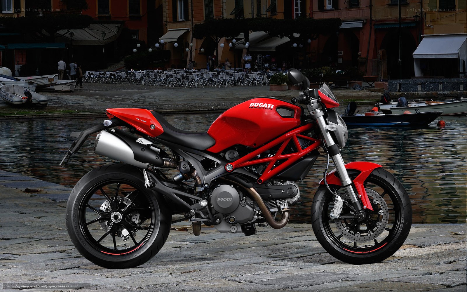 Red Ducati motorcycle by canal