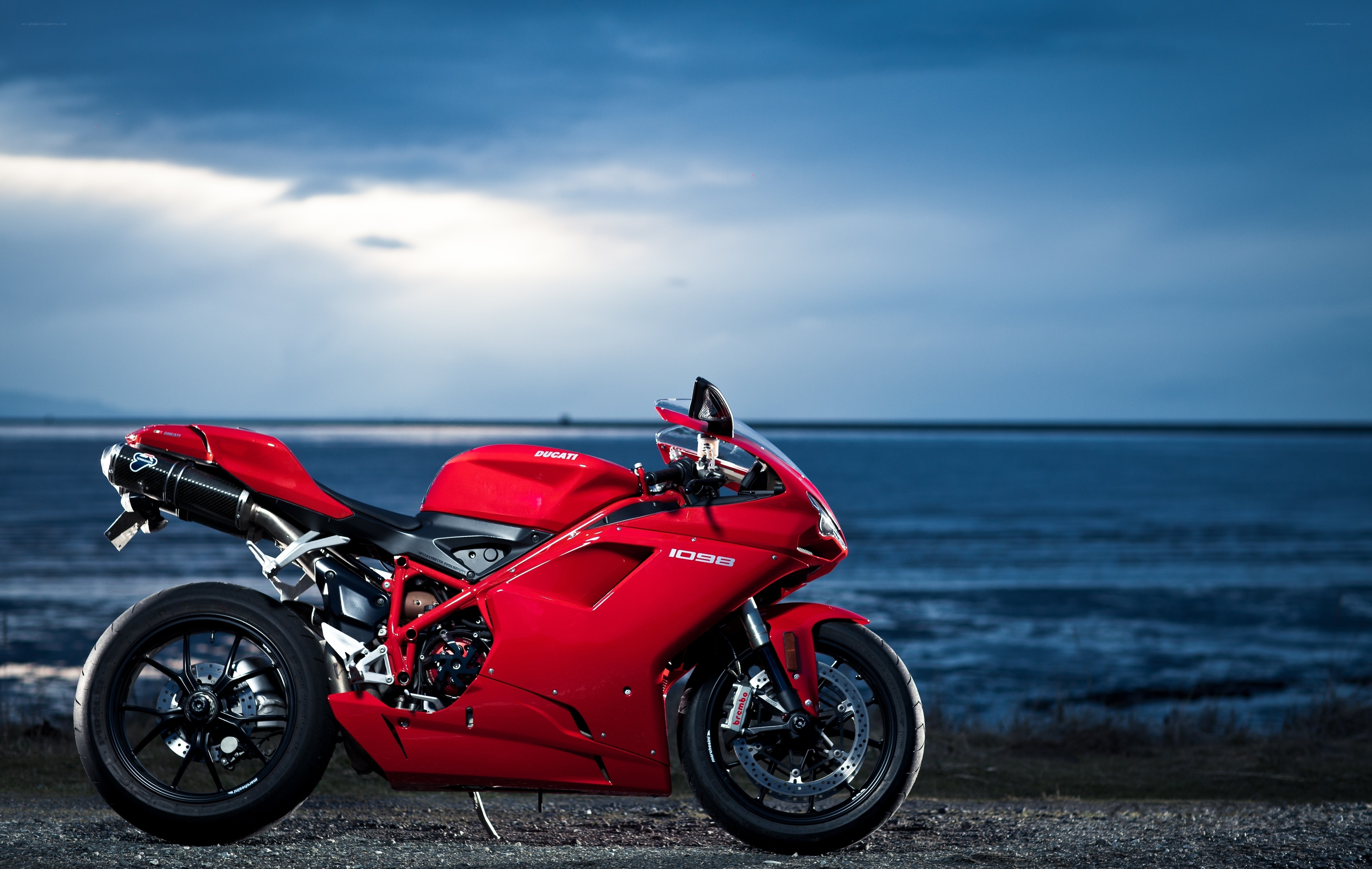 Red Ducati motorcycle by the sea