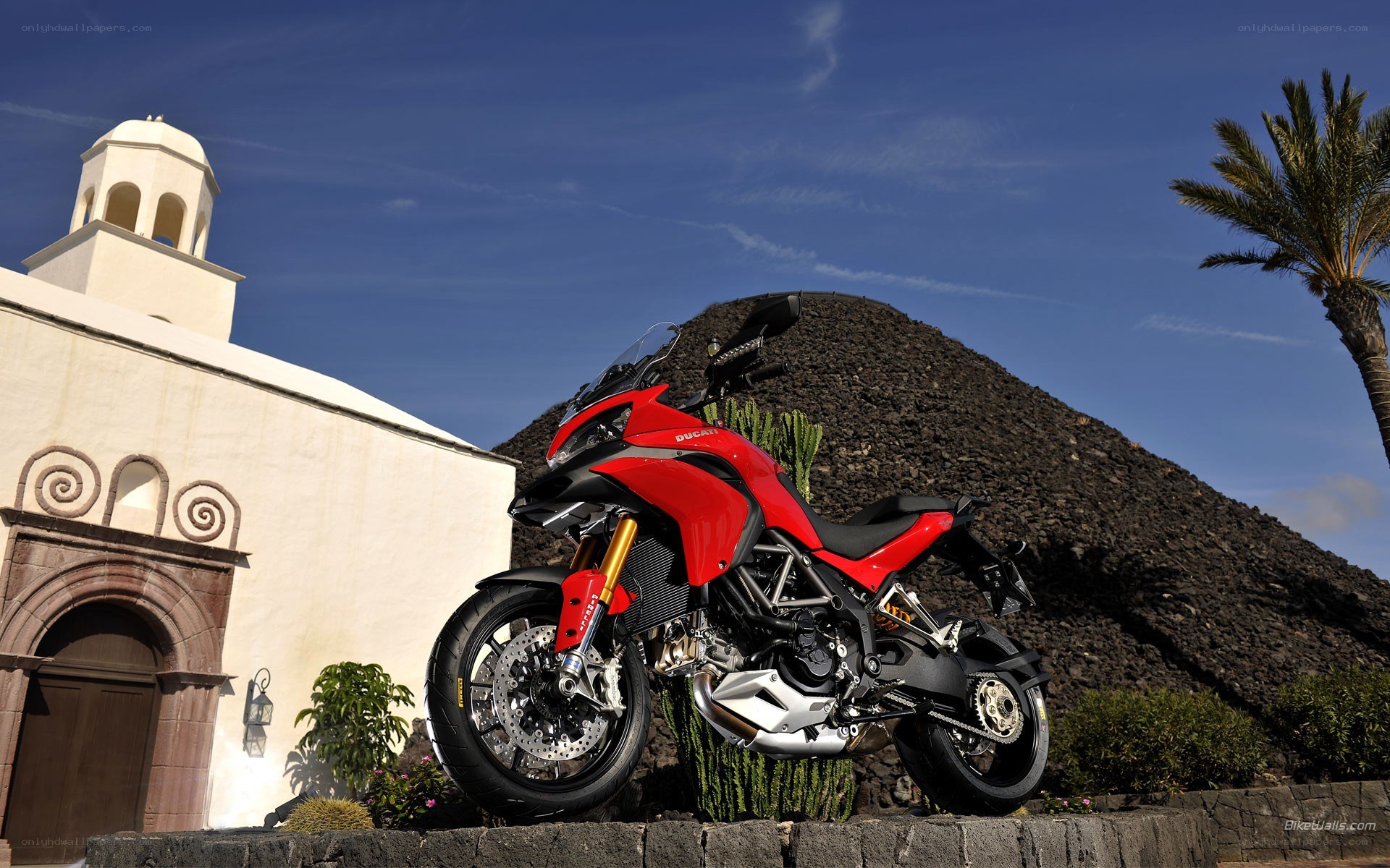 Red Ducati motorcycle in scenic setting