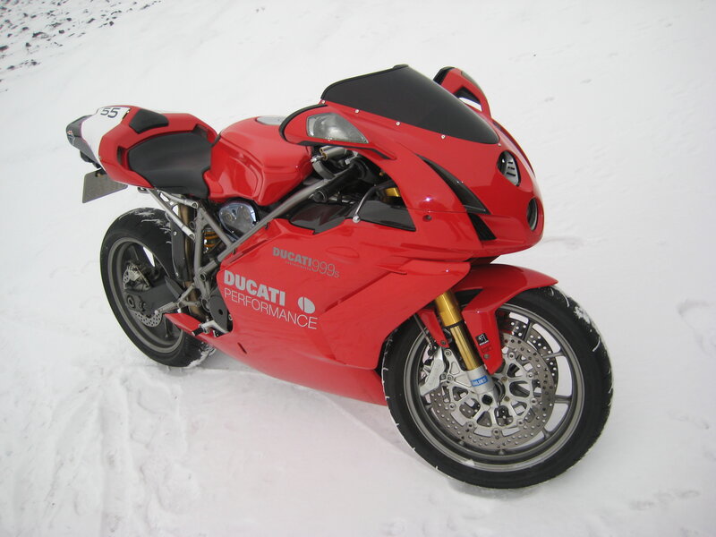 Red Ducati motorcycle in snow
