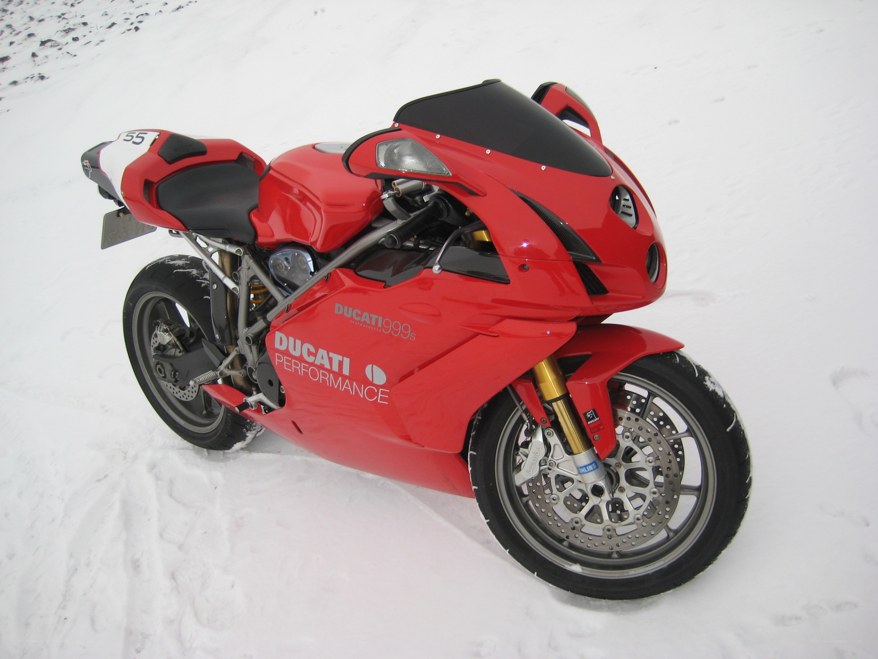 Red Ducati motorcycle in snow