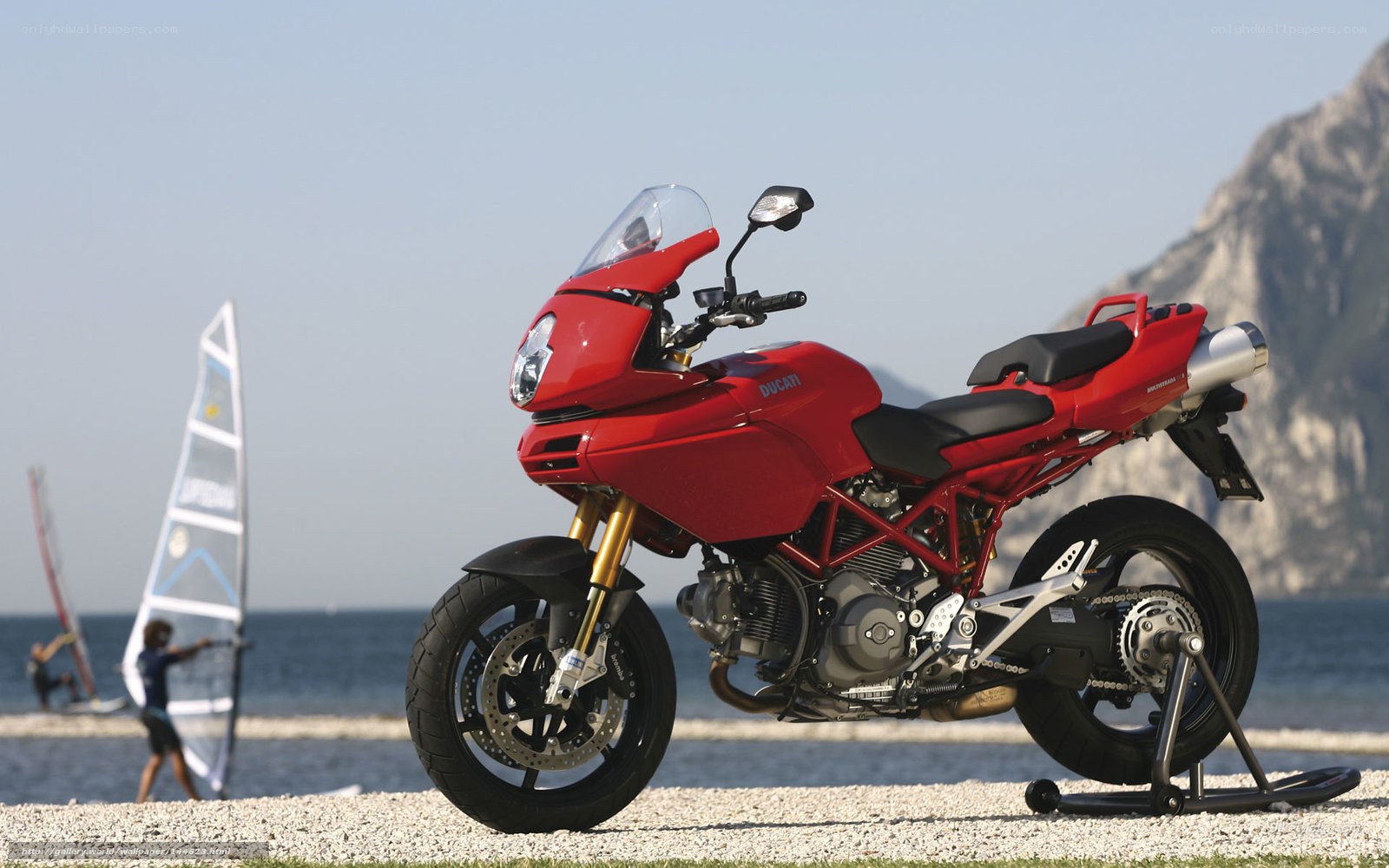Red Ducati motorcycle on beach