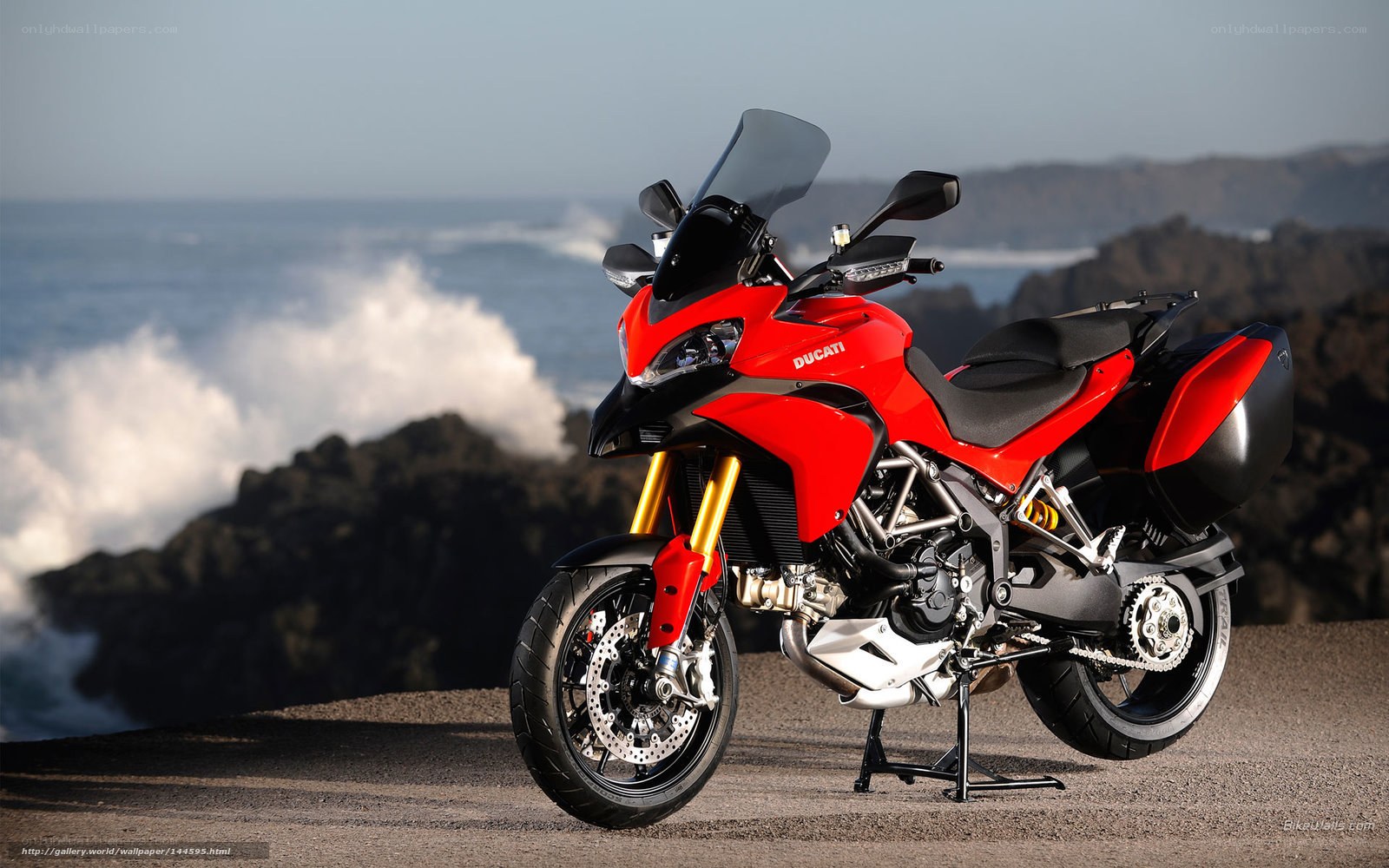 Red Ducati motorcycle on coast