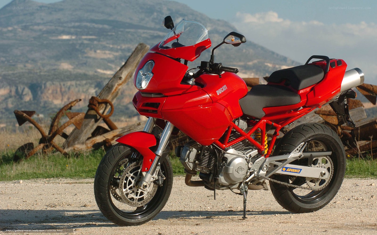 Red Ducati motorcycle on gravel
