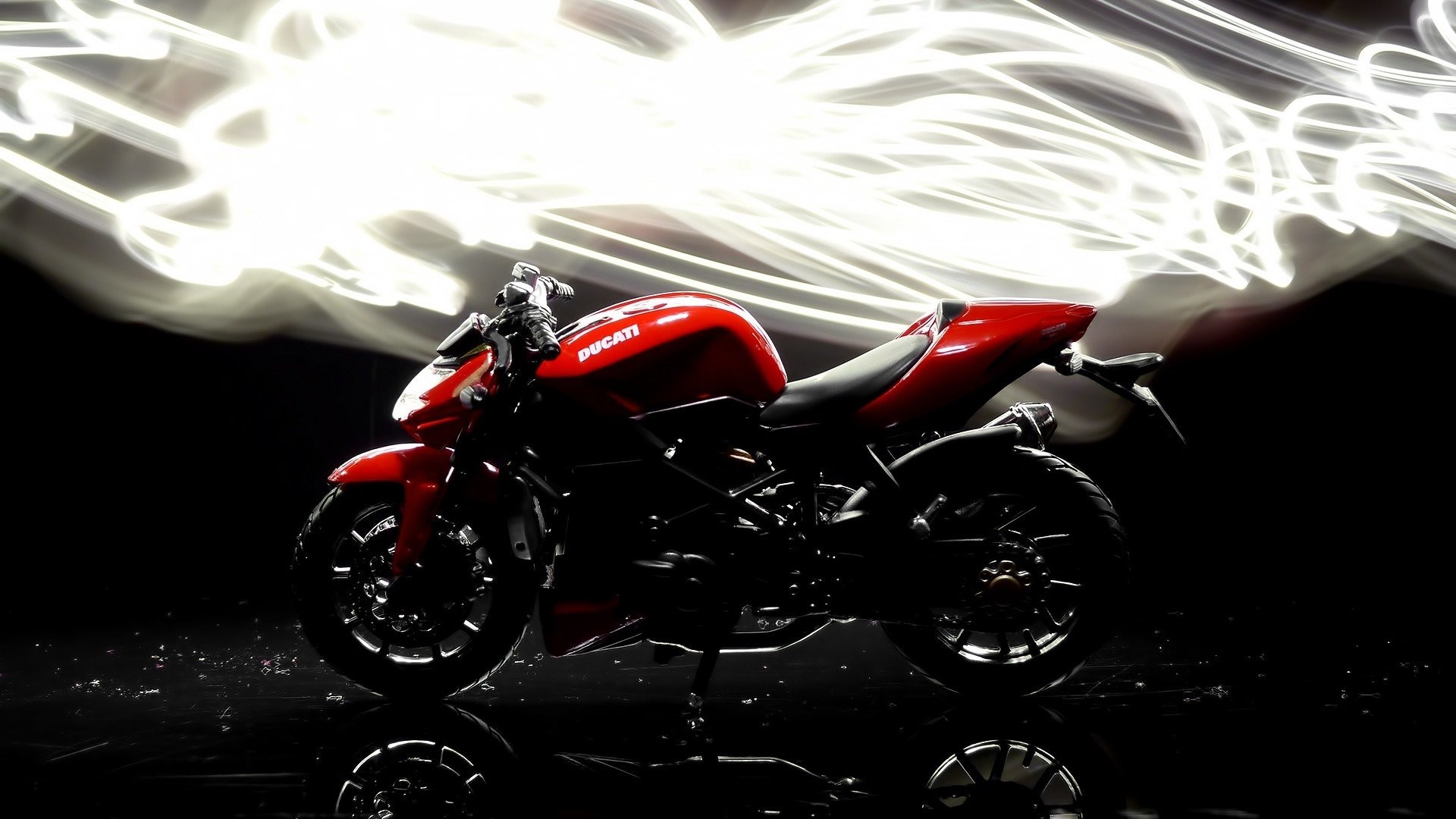 Red Ducati motorcycle with light trails