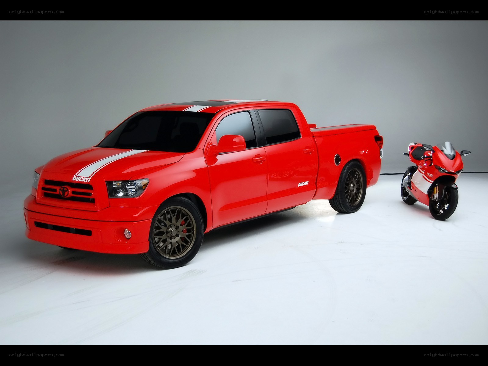 Red Ducati-themed pickup and motorcycle