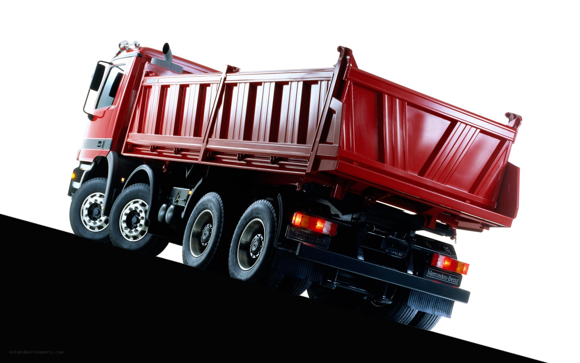 Red dump truck on incline