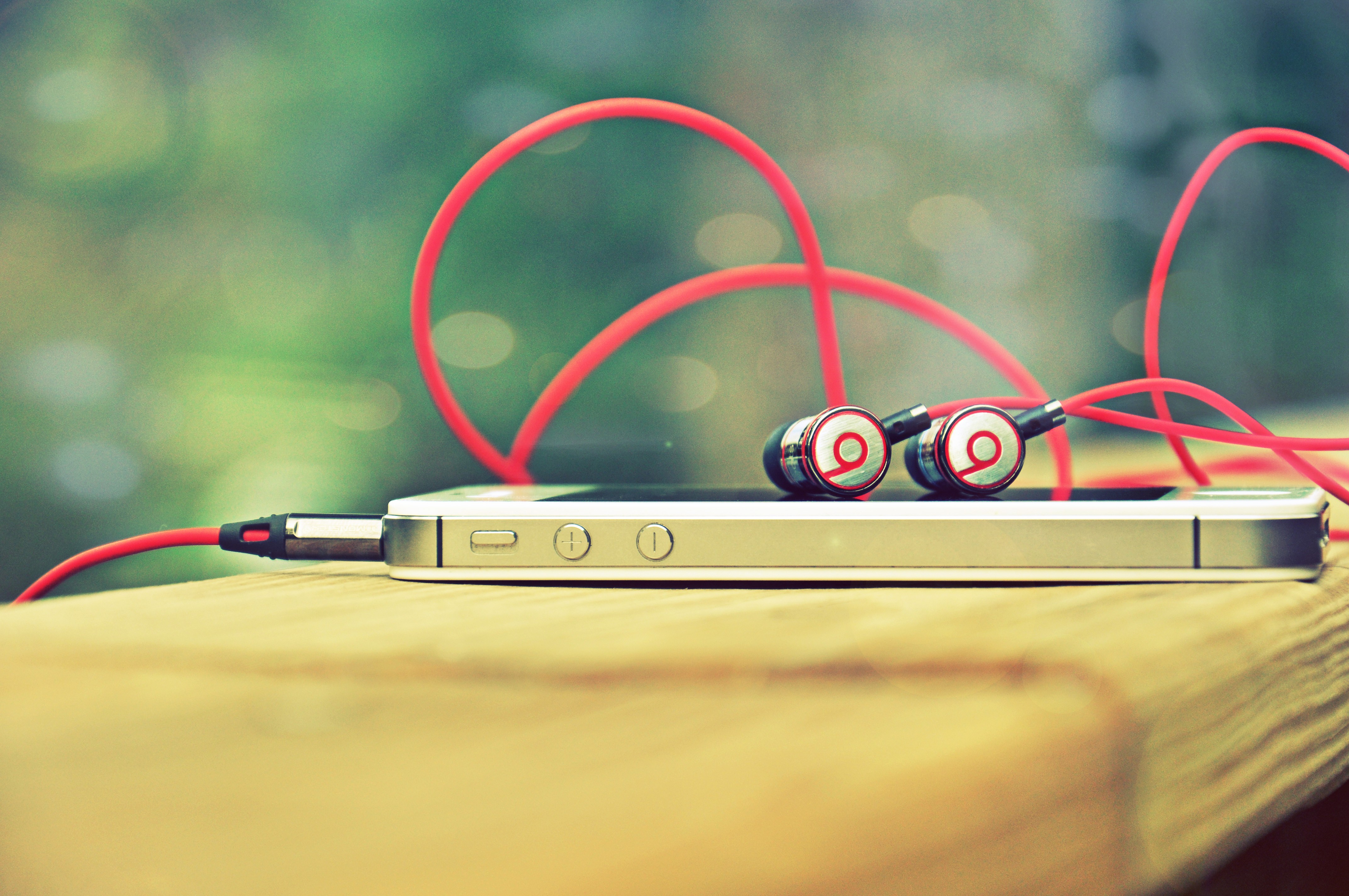 Red earbuds on smartphone