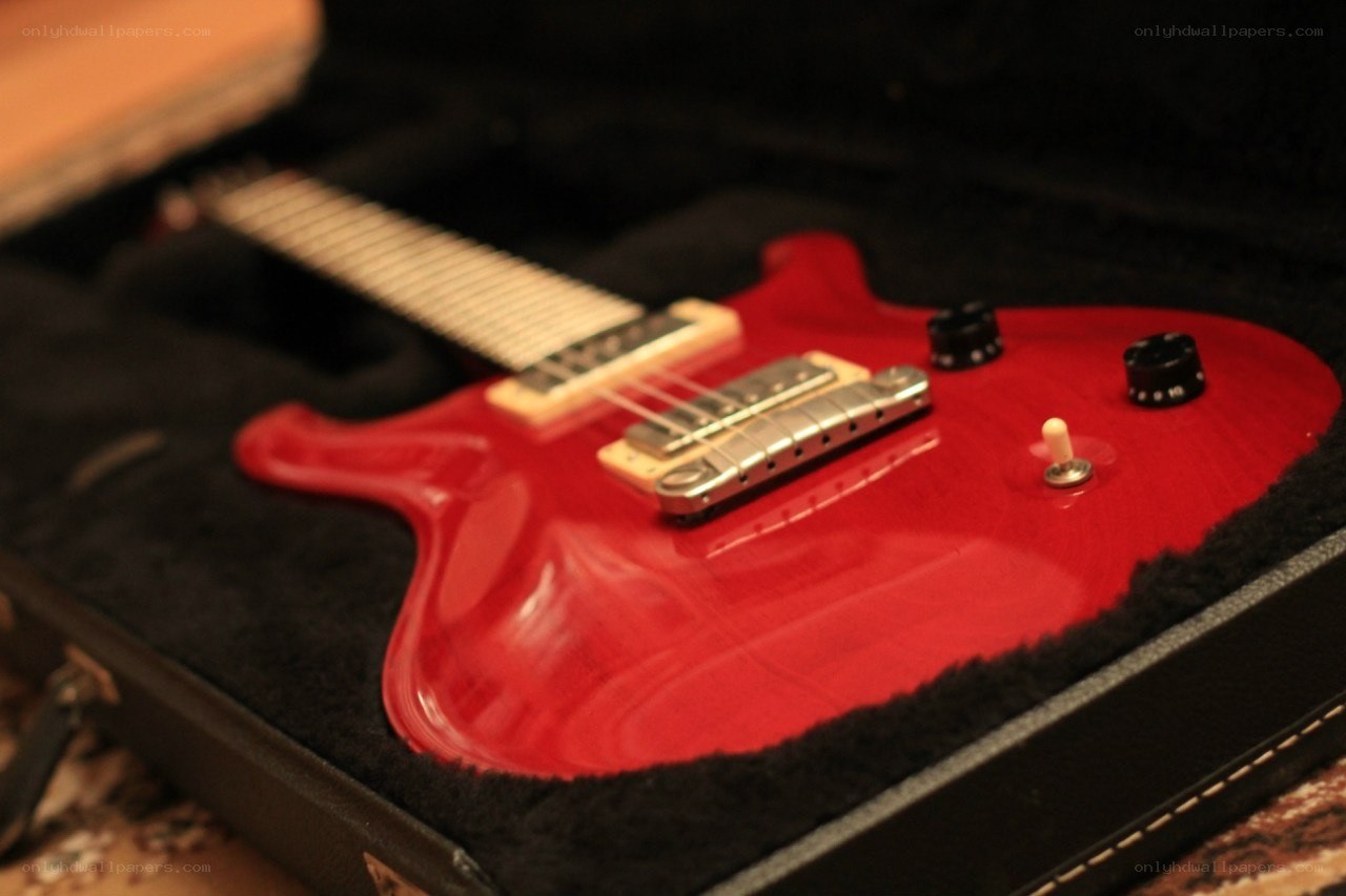 Red electric guitar in case