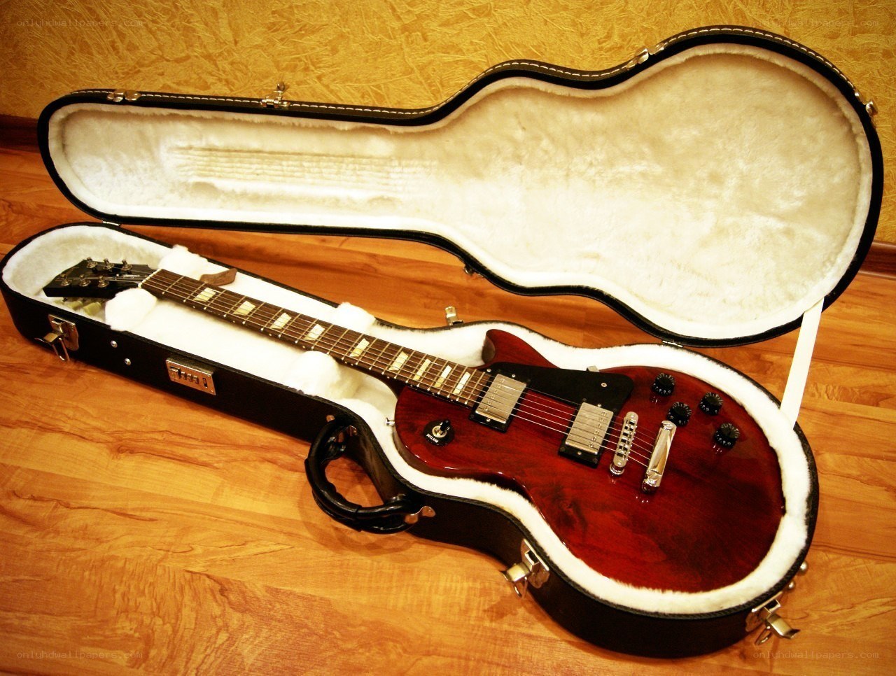 Red electric guitar in case