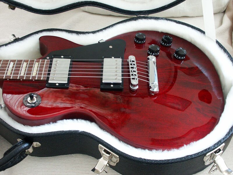 Red electric guitar in case