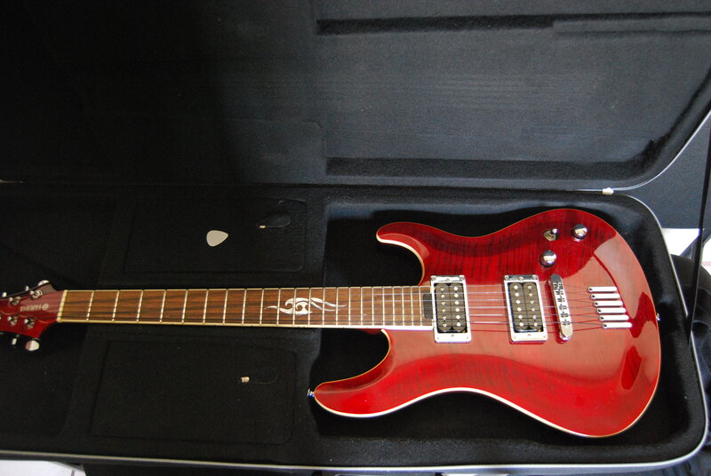 red electric guitar in case