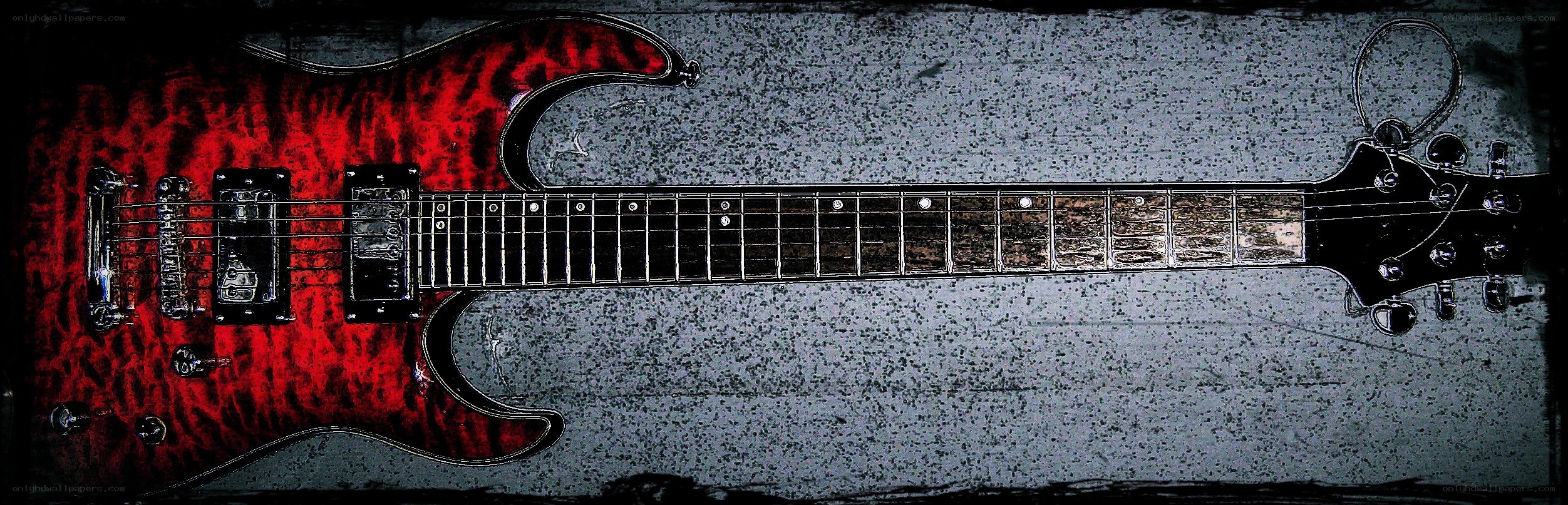 red electric guitar on textured surface