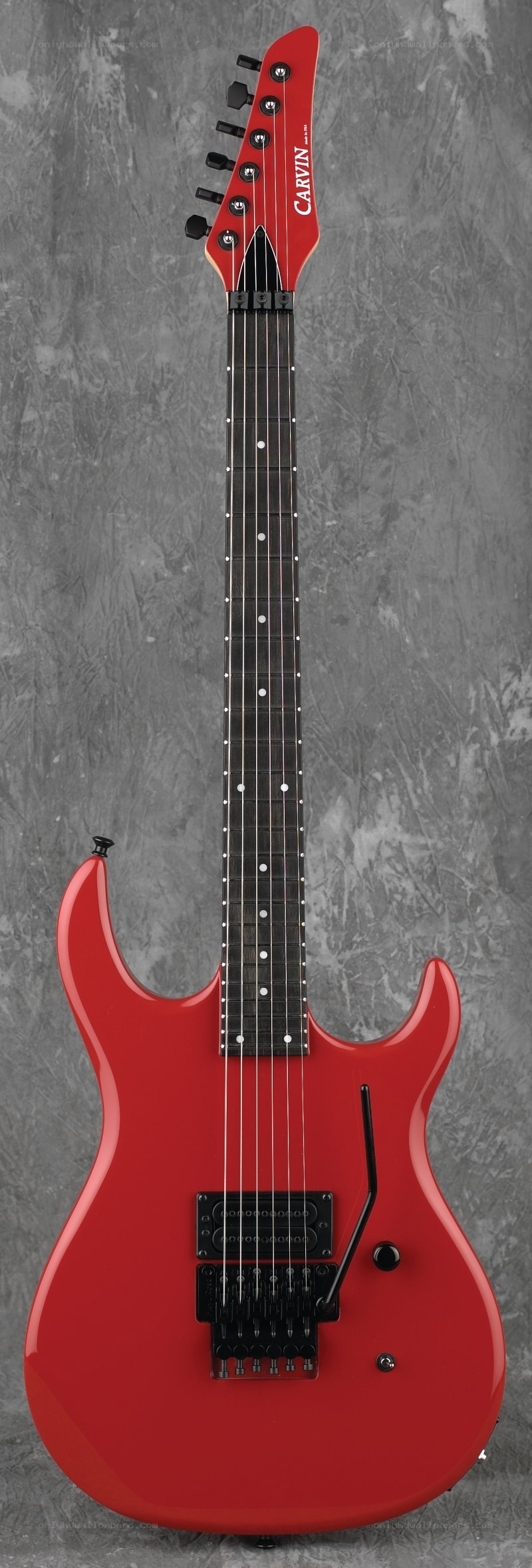 red electric guitar with black hardware