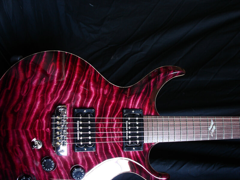 red electric guitar with flamed maple top