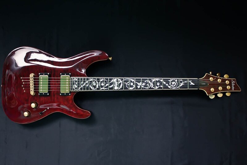 red electric guitar with inlays