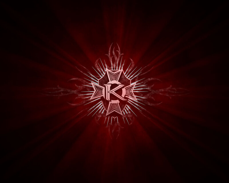 red emblem with glowing rays