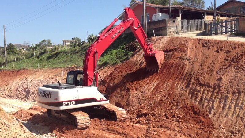 Red Excavator Digging