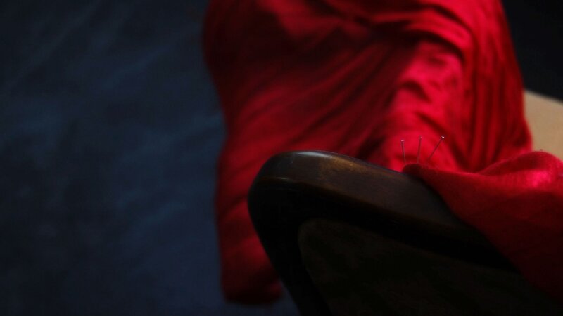 Red fabric on wooden chair