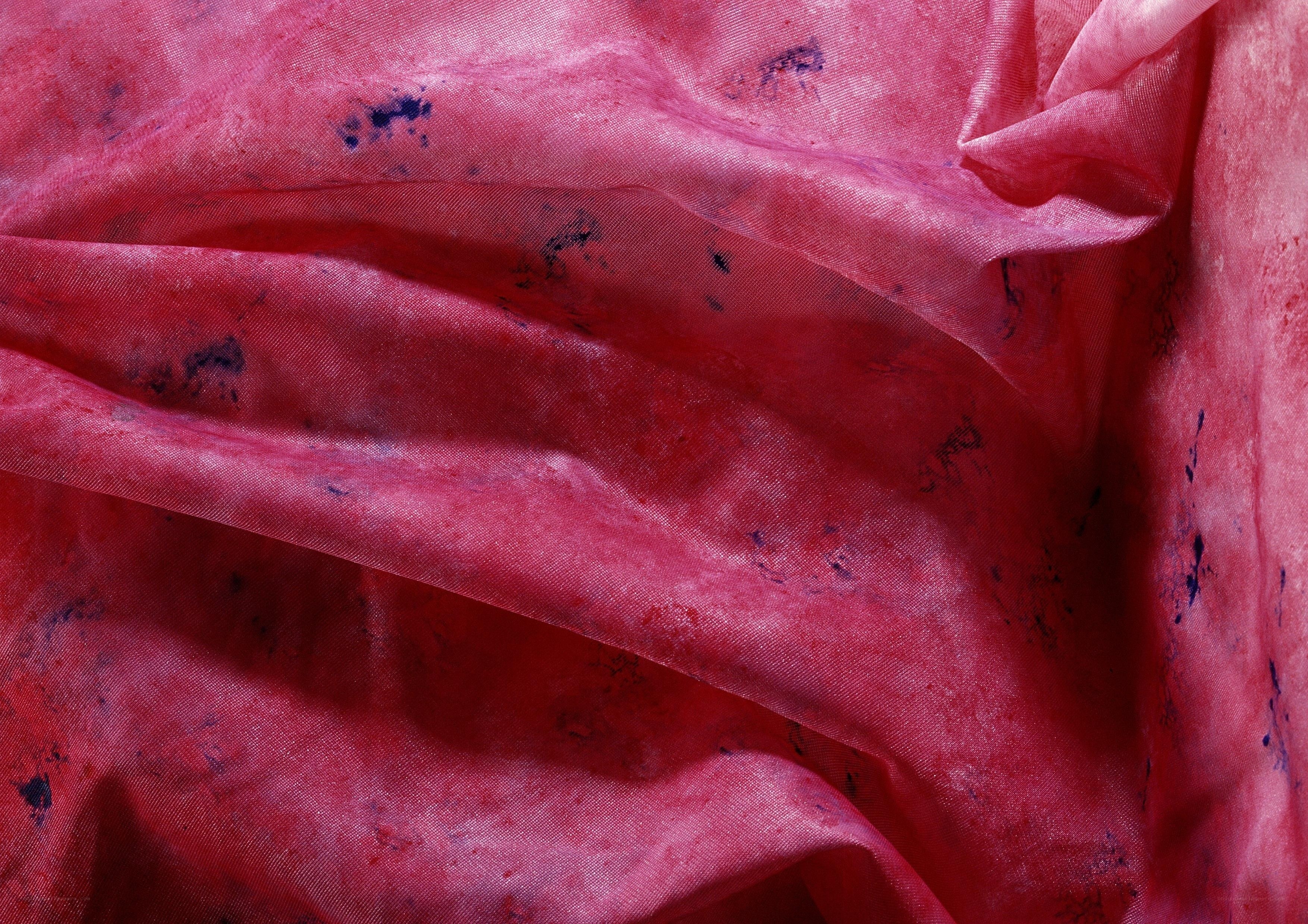 red fabric with blue stains