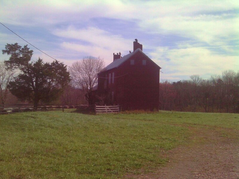 Red Farmhouse in Field