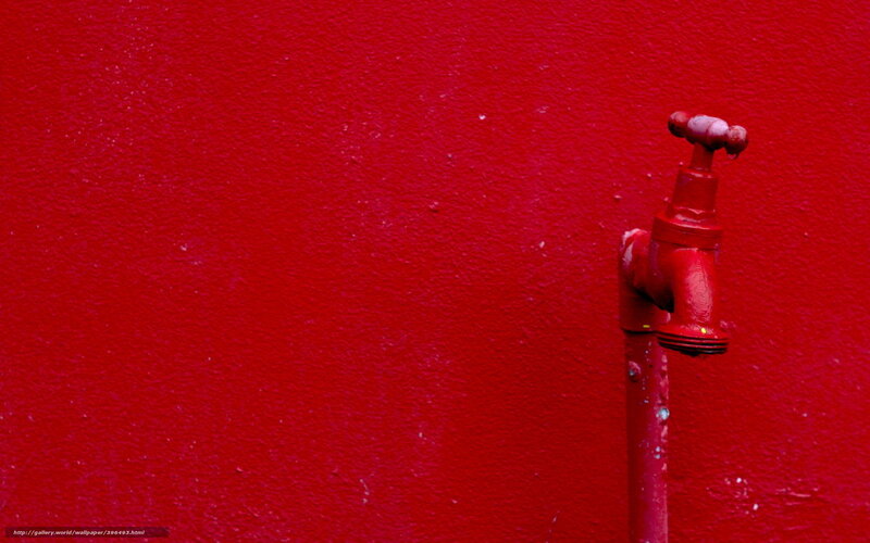 red faucet on red wall