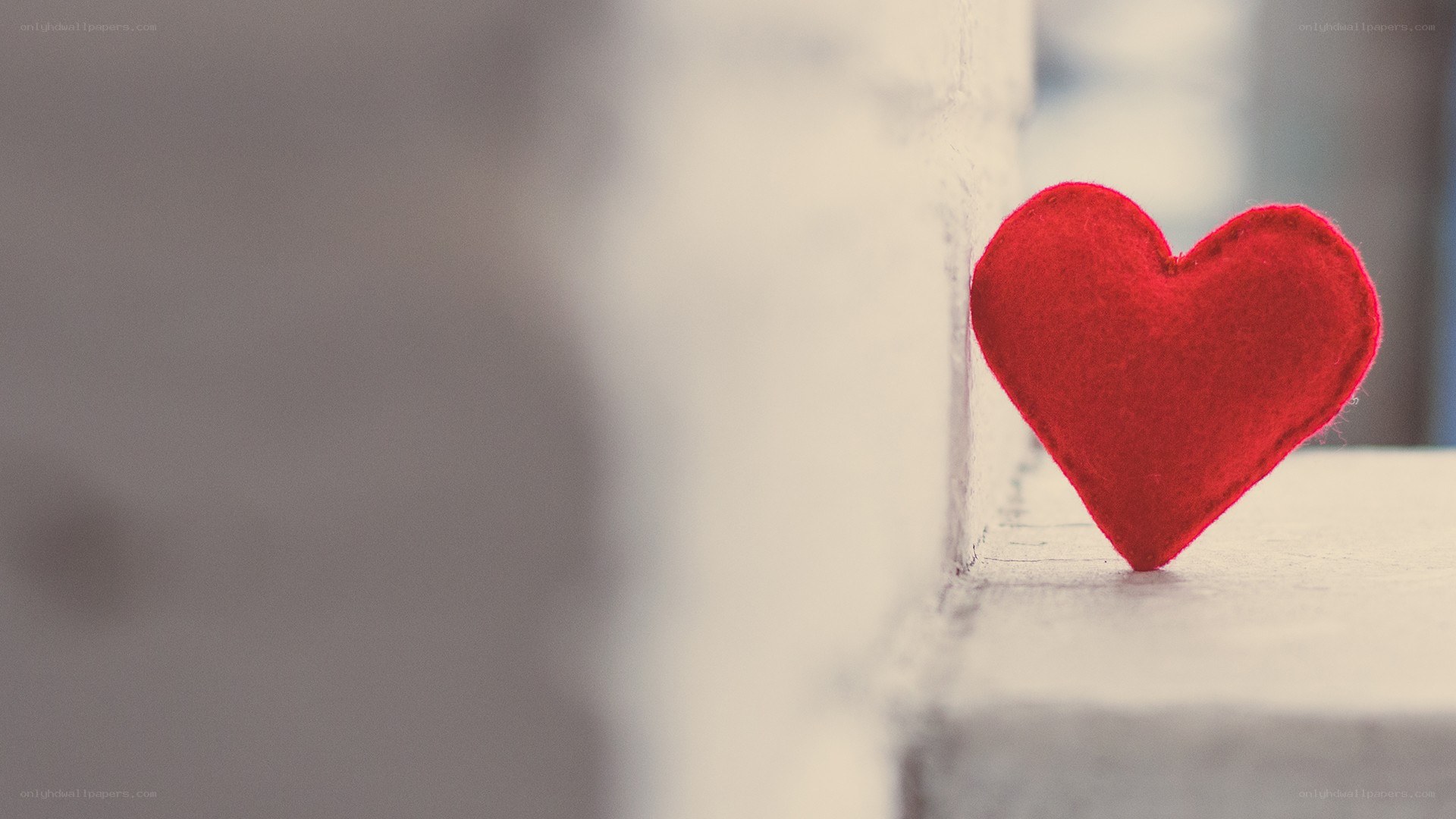 Red felt heart on a windowsill