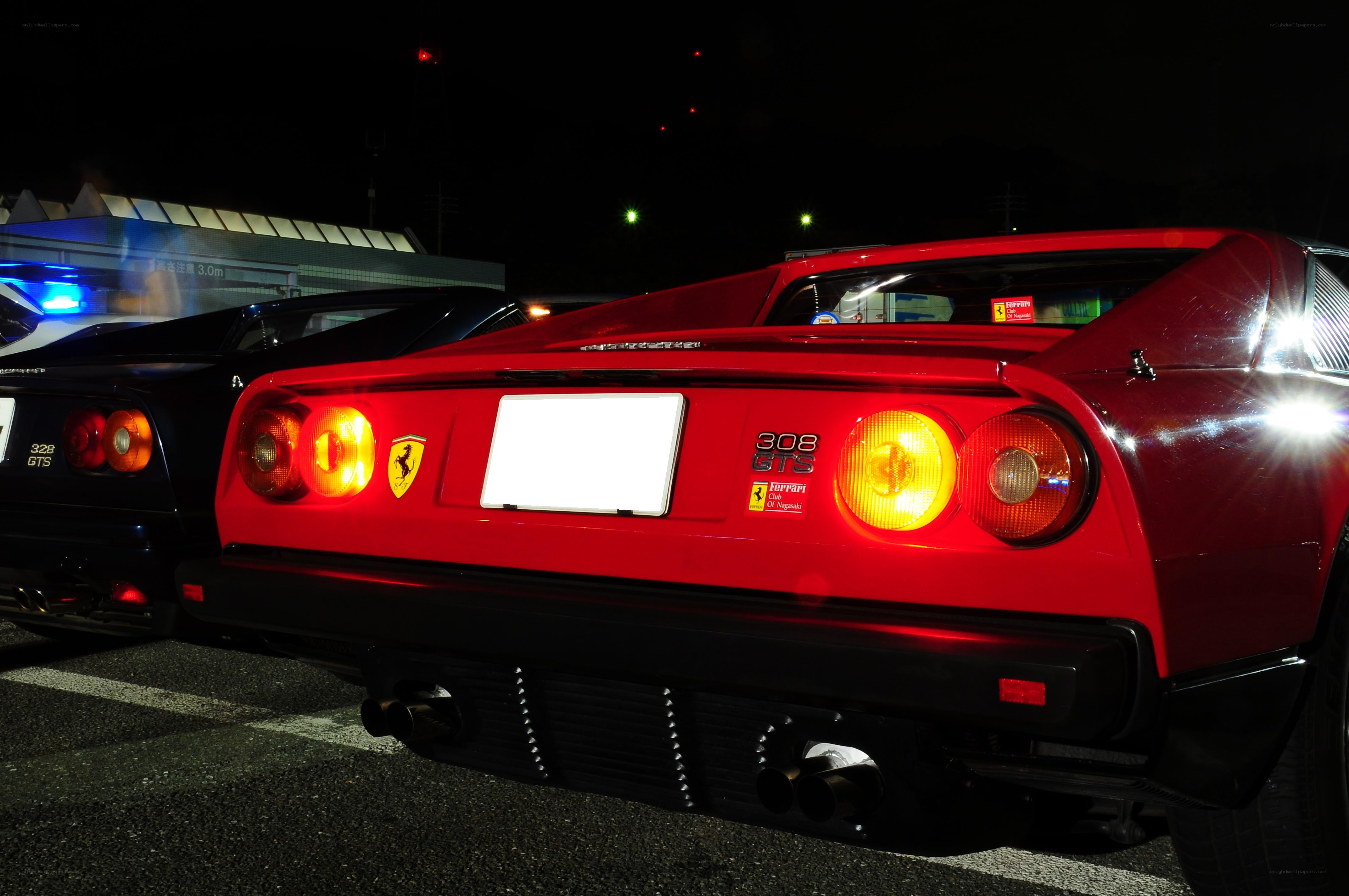 Red Ferrari 308 GTS at night