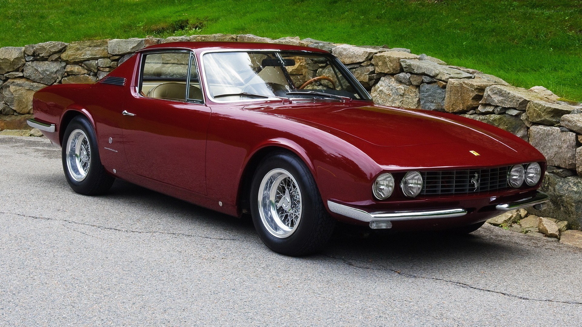 Red Ferrari 330 GT parked
