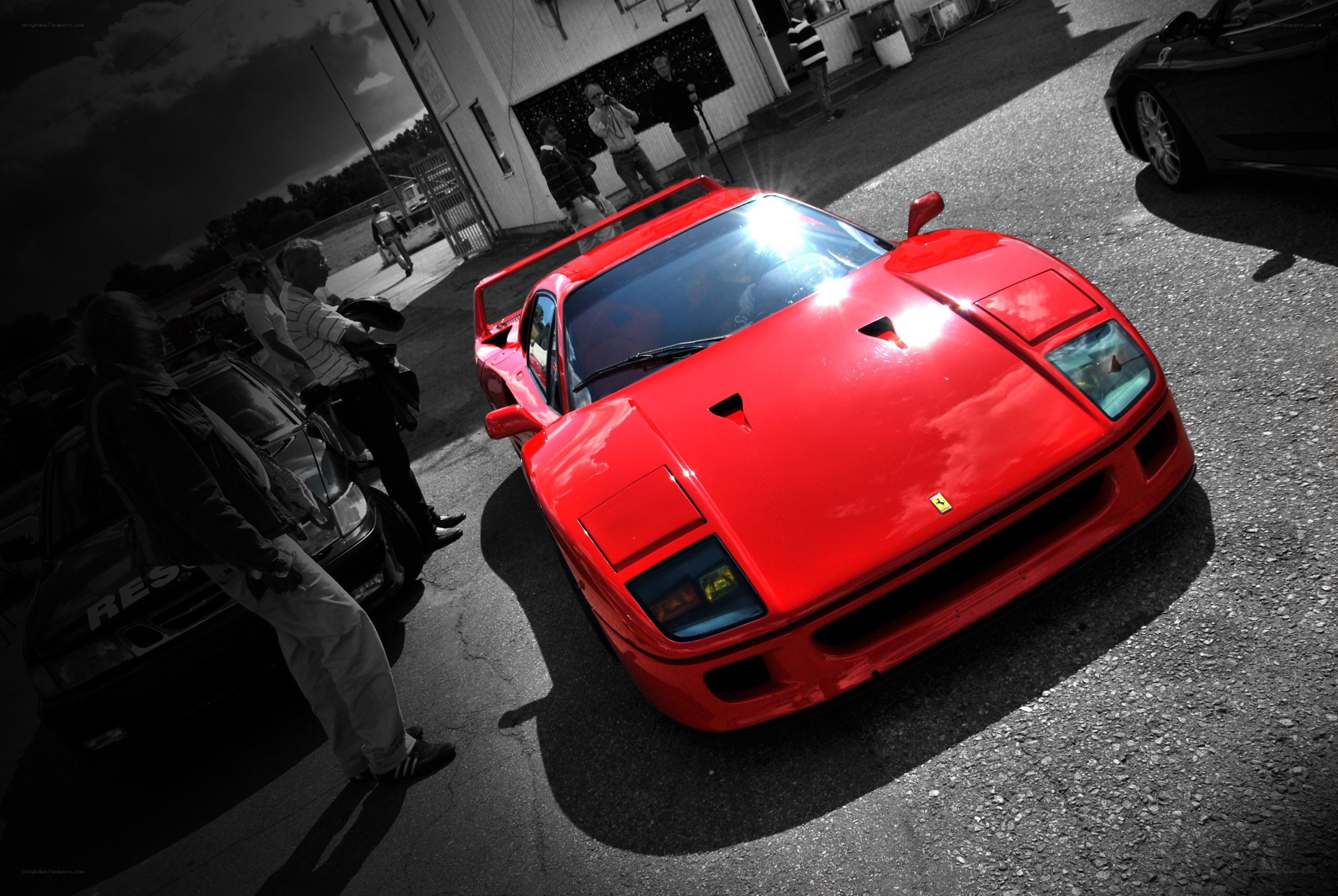 Red Ferrari at a car event