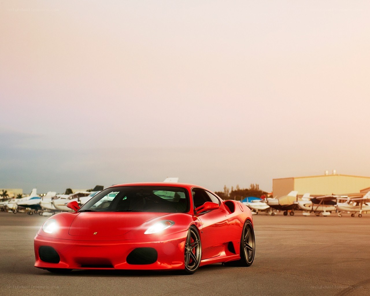 Red Ferrari at airfield