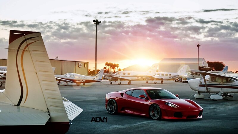 Red Ferrari at airport tarmac