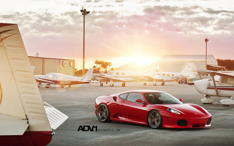 Red Ferrari at an airfield