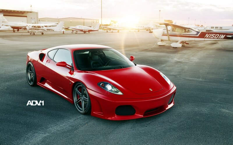 Red Ferrari at an airfield