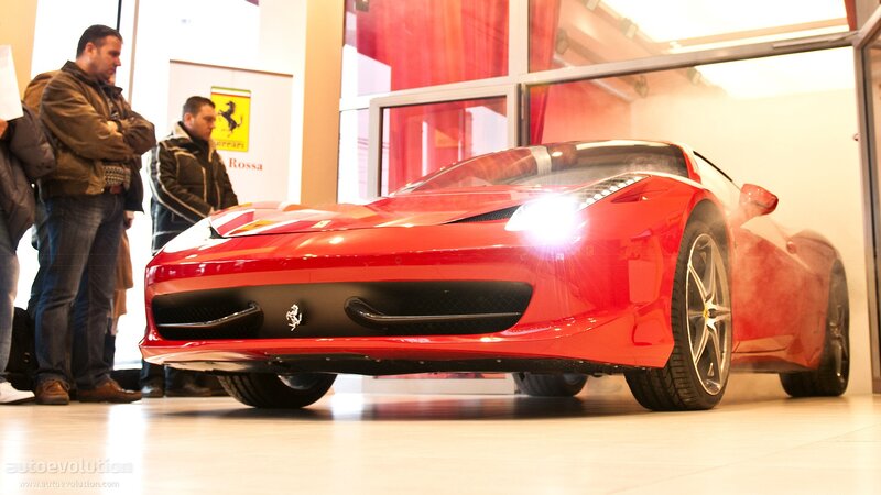 Red Ferrari at an indoor event