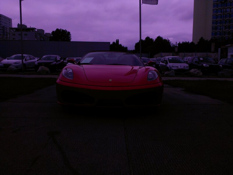 Red Ferrari at dusk